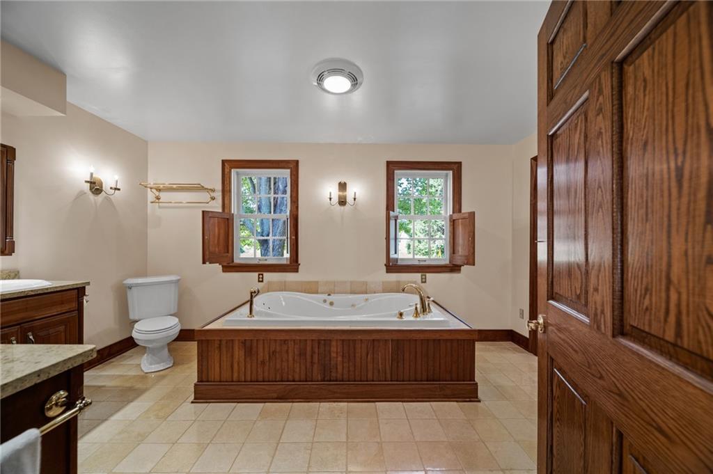 21368 Church Street Venango, PA 16440 - Photo 20 of 49 a spacious bathroom with a tub sink and mirror