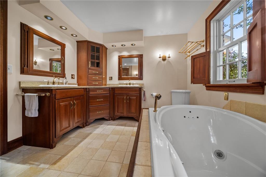 21368 Church Street Venango, PA 16440 - Photo 21 of 49 a spacious bathroom with a tub sink and mirror