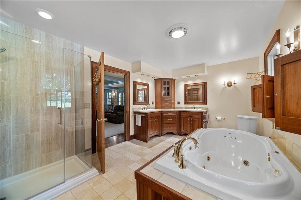 21368 Church Street Venango, PA 16440 - Photo 22 of 49 a bathroom with a bathtub and a shower