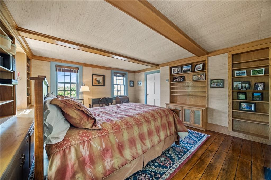 21368 Church Street Venango, PA 16440 - Photo 28 of 49 a bedroom with a large bed and a book shelf