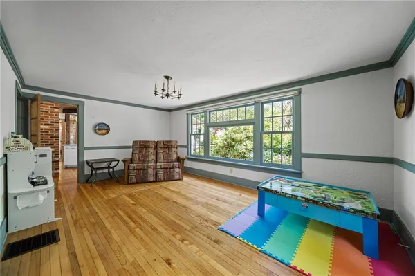 a bedroom with windows and a bed