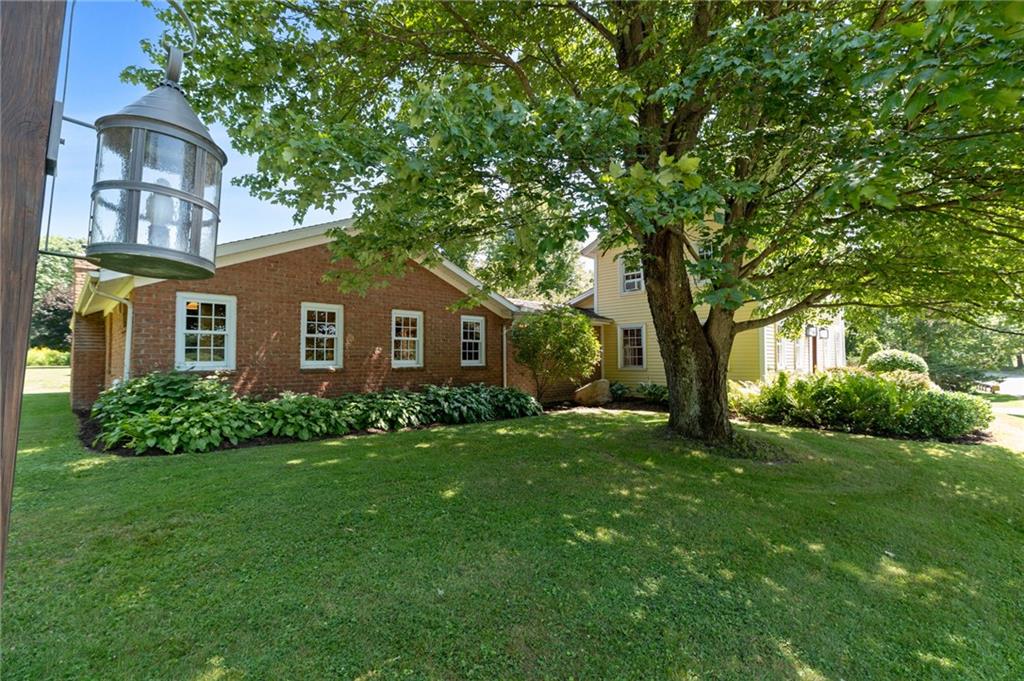 21368 Church Street Venango, PA 16440 - Photo 41 of 49 a front view of a house with a garden