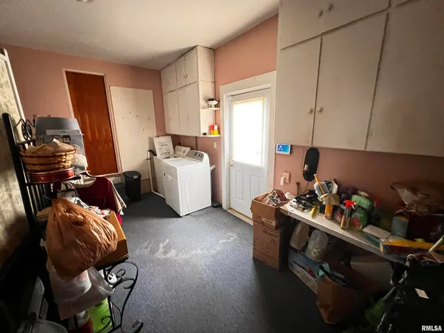 a room with furniture and musical instruments