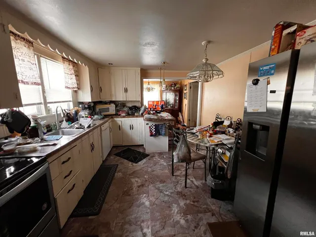 a kitchen with sink cabinets and window
