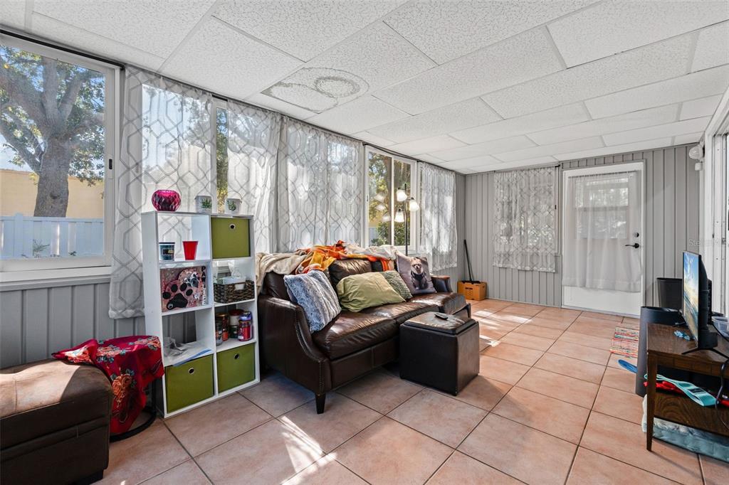 3721 43rd Avenue West Bradenton, FL 34205 - Photo 15 of 26 a bedroom with furniture and a flat screen tv