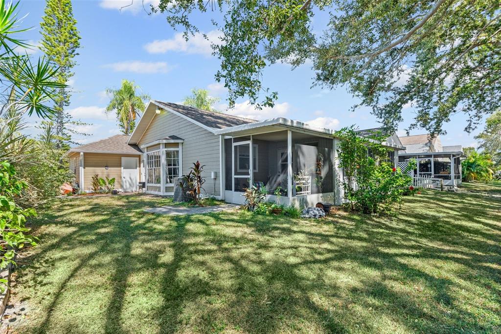 3721 43rd Avenue West Bradenton, FL 34205 - Photo 22 of 26 a front view of a house with a garden
