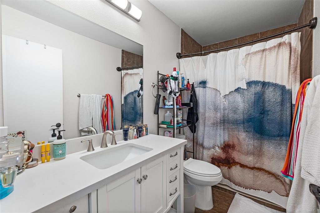 3721 43rd Avenue West Bradenton, FL 34205 - Photo 6 of 26 a bathroom with a sink toilet and shower