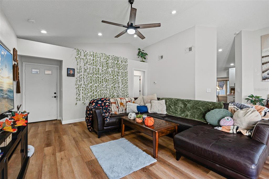 3721 43rd Avenue West Bradenton, FL 34205 - Photo 8 of 26 a living room with furniture and wooden floor