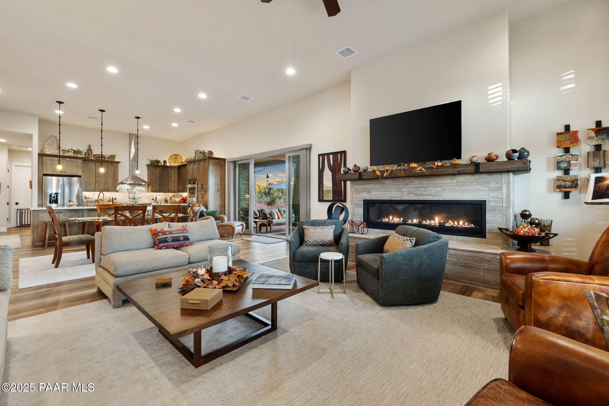 15505 North Double Adobe Road Prescott, AZ 86305 - Photo 25 of 84 a living room with furniture a flat screen tv and a fireplace