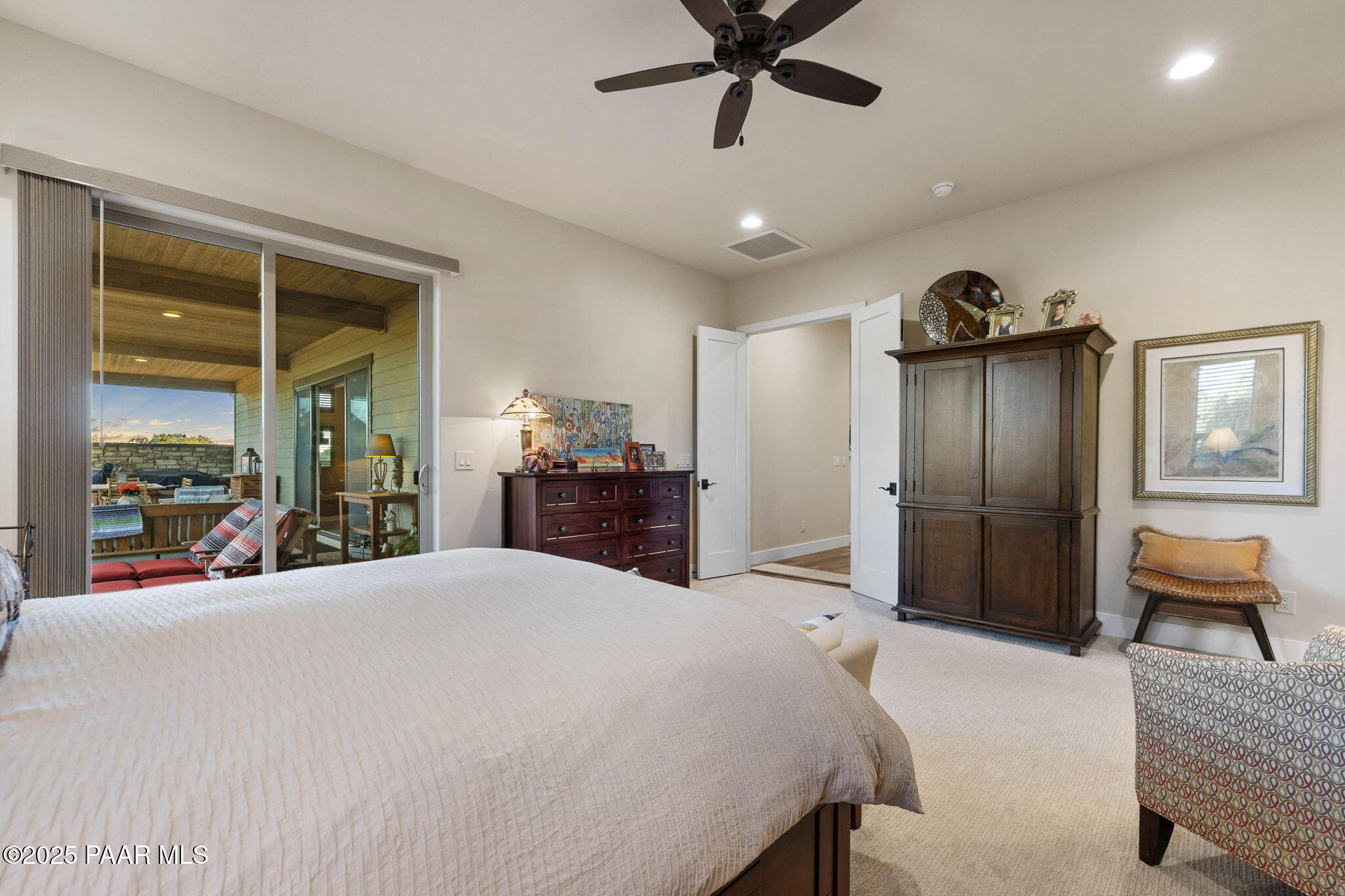 15505 North Double Adobe Road Prescott, AZ 86305 - Photo 34 of 84 a large bedroom with a bed and a large mirror