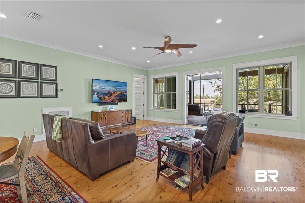 2730 Gator Road Mobile, AL 36605 - Photo 14 of 42 Living room featuring ornamental molding, light wood-type flooring, a ceiling fan, and recessed lighting