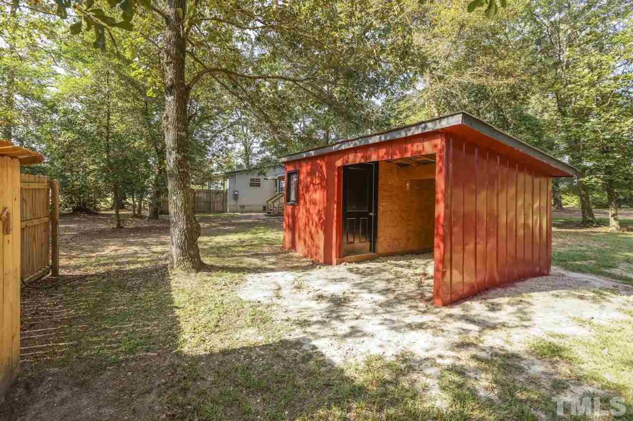 2670 Reedy Prong Church Road Newton Grove, NC 28366 - Photo 22 of 25 a front view of a house with a yard