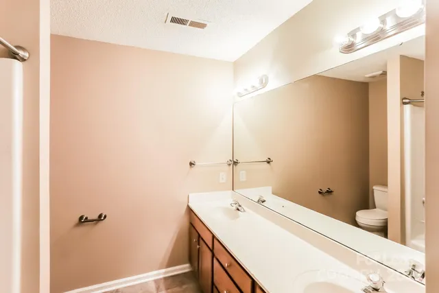 a bathroom with a sink and mirror