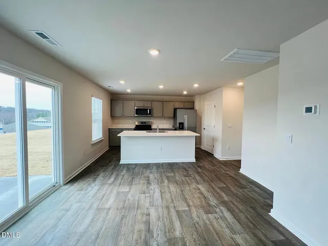 a view of kitchen with wooden floor