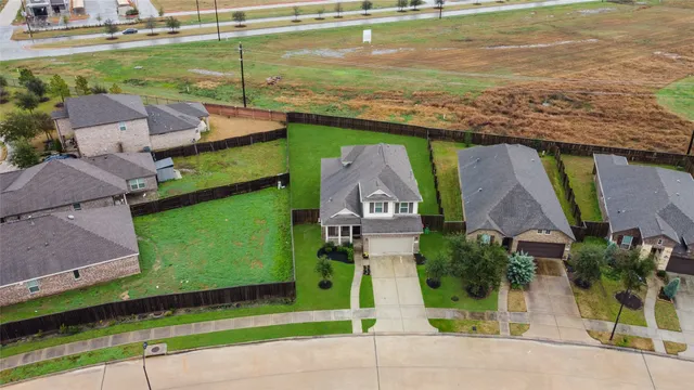 an aerial view of a house with a garden