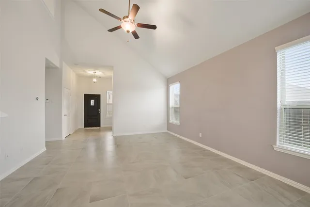 a view of an empty room with a window