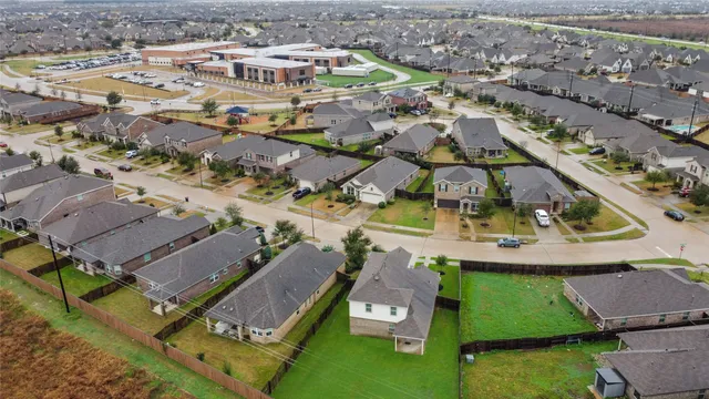an aerial view of residential houses with outdoor space