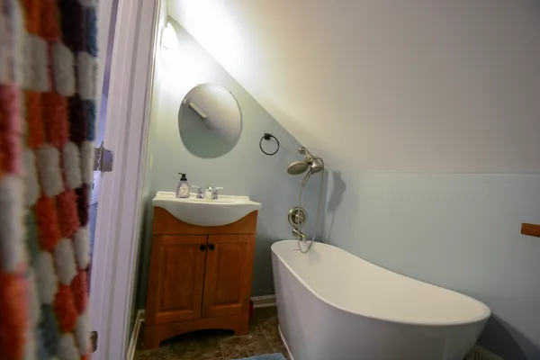 a bathroom with a sink and mirror