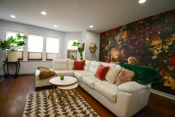a living room with furniture and a large window