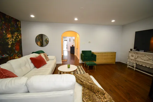 a living room with furniture and a flat screen tv