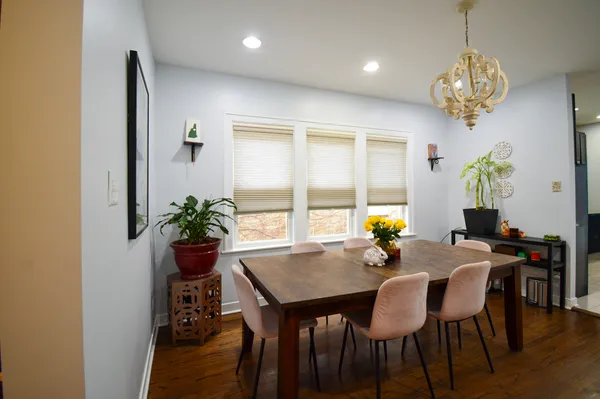 a view of a dining room with furniture window and wooden floor