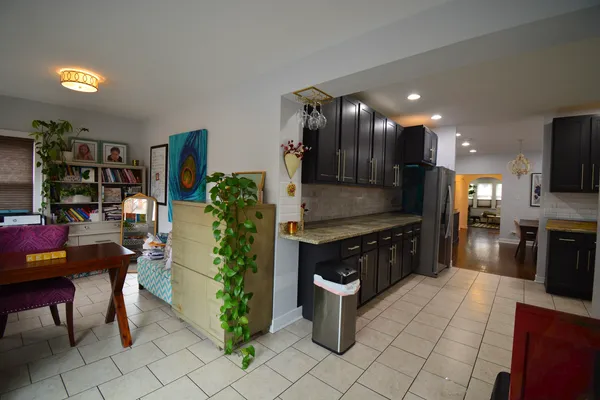 a kitchen with stainless steel appliances kitchen island granite countertop a sink and cabinets