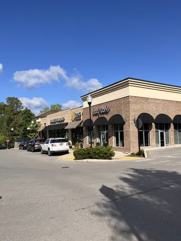 a view of a building next to a road