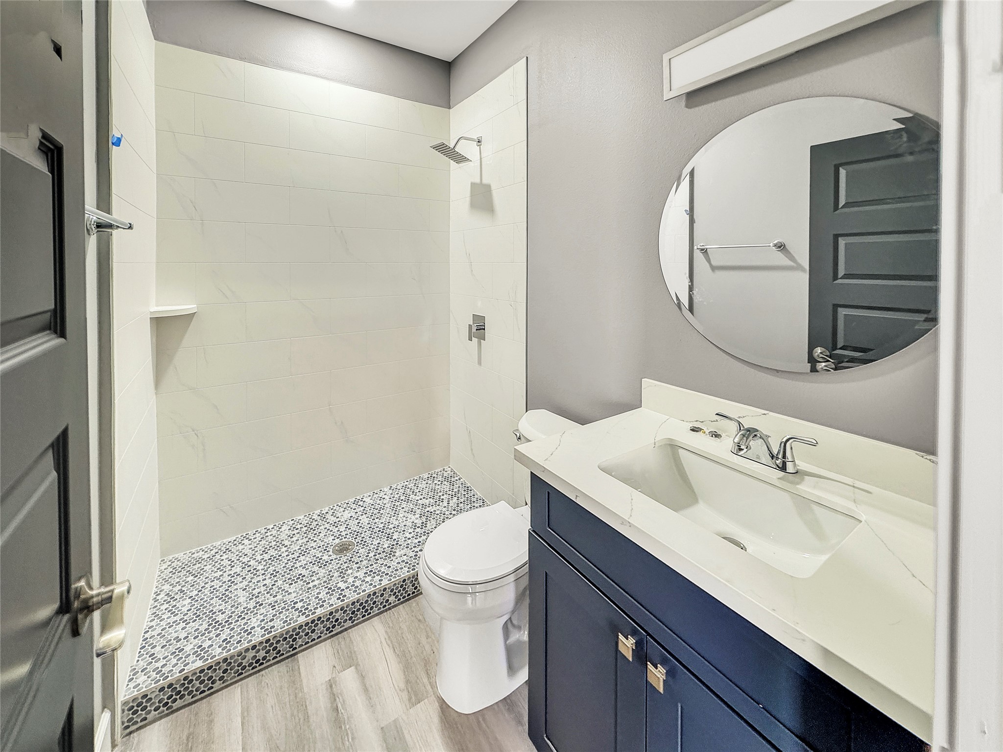 4817 Los Angeles Street Houston, TX 77026 - Photo 18 of 20 a bathroom with a sink a toilet and shower