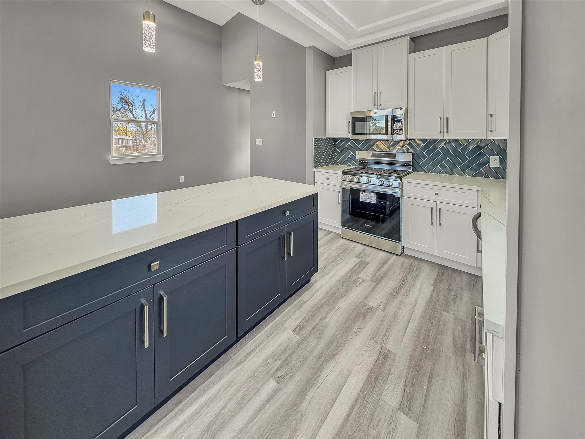 4817 Los Angeles Street Houston, TX 77026 - Photo 9 of 20 a kitchen with wooden cabinets and white appliances