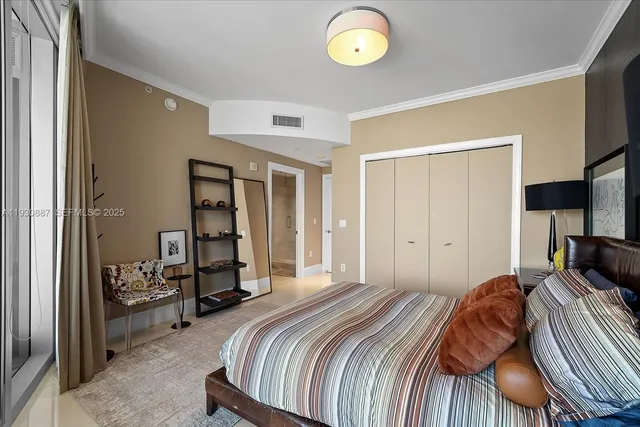 a bedroom with a bed and a cabinets