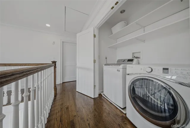 a view of a hallway with washer and dryer