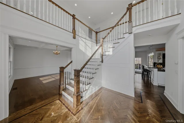 a view of entryway and hall with wooden floor