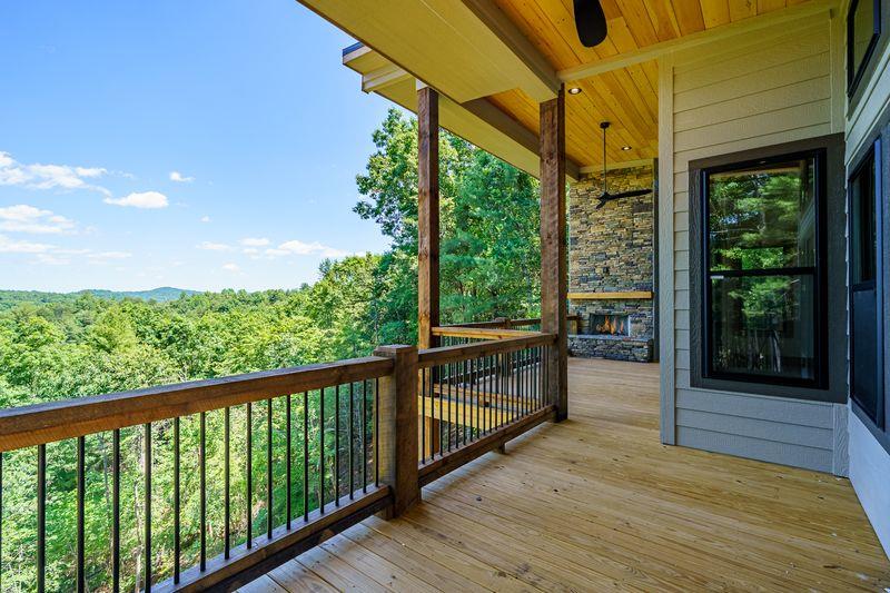 216 Old Orchard Road Ellijay, GA 30536 - Photo 1 of 59 a view of a balcony with wooden floor