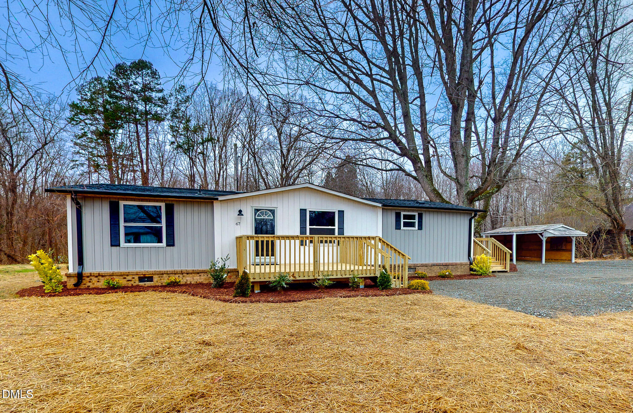 67 Halifax Road Roxboro, NC 27574 - Photo 1 of 48 a front view of a house with a yard covered in snow