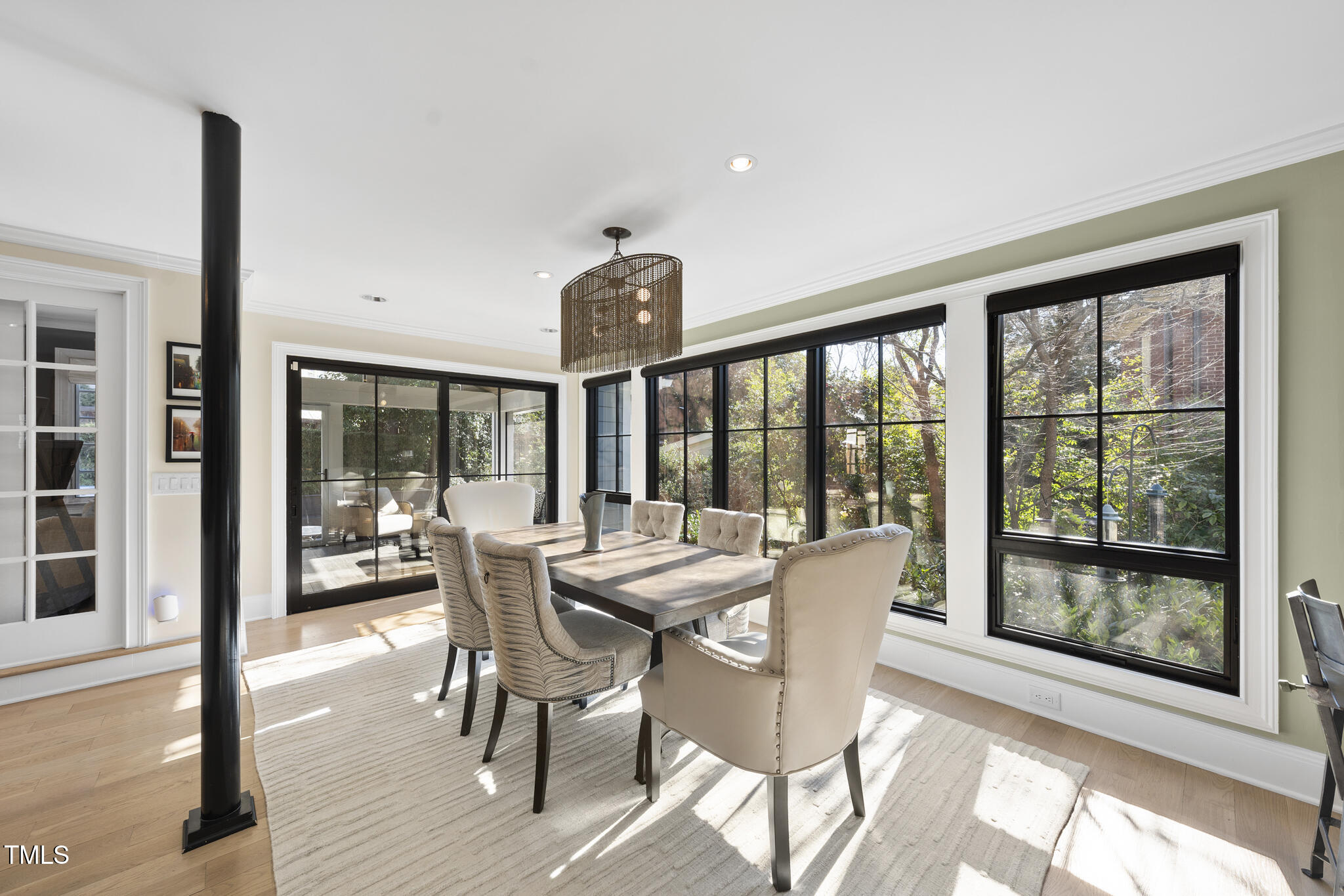 920 West Johnson Street Raleigh, NC 27605 - Photo 13 of 42 a view of a dining room with furniture large windows and wooden floor