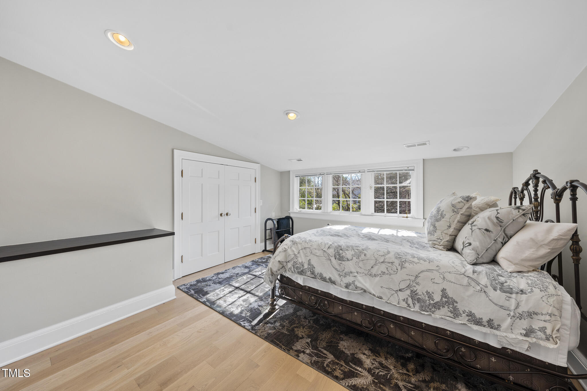 920 West Johnson Street Raleigh, NC 27605 - Photo 27 of 42 a bedroom with a large bed and a window