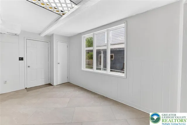 a view of an empty room with a window