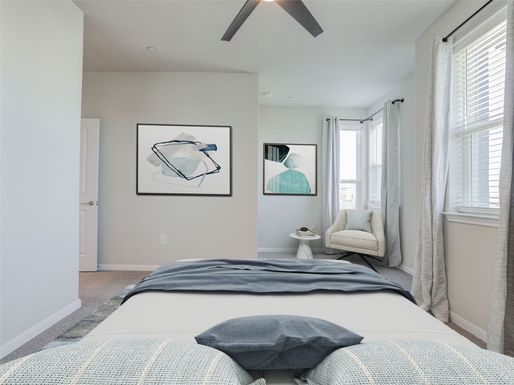 9015 Cattle Baron Path, Unit 502 Austin, TX 78747 - Photo 21 of 40 a bedroom with a bed and a window