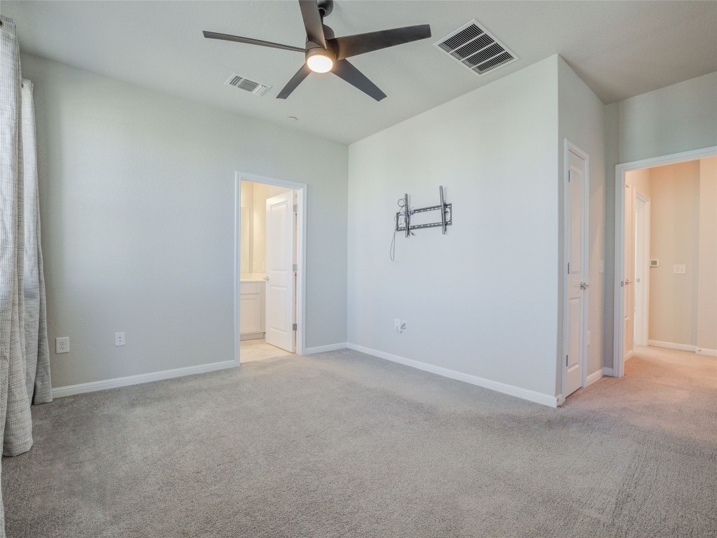 9015 Cattle Baron Path, Unit 502 Austin, TX 78747 - Photo 24 of 40 a view of an empty room and a ceiling fan window