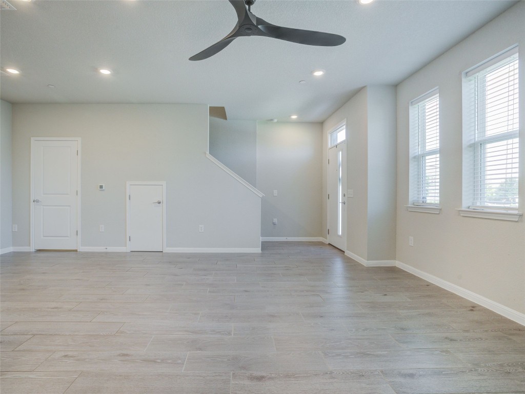 9015 Cattle Baron Path, Unit 502 Austin, TX 78747 - Photo 29 of 40 wooden floor in an empty room with a window