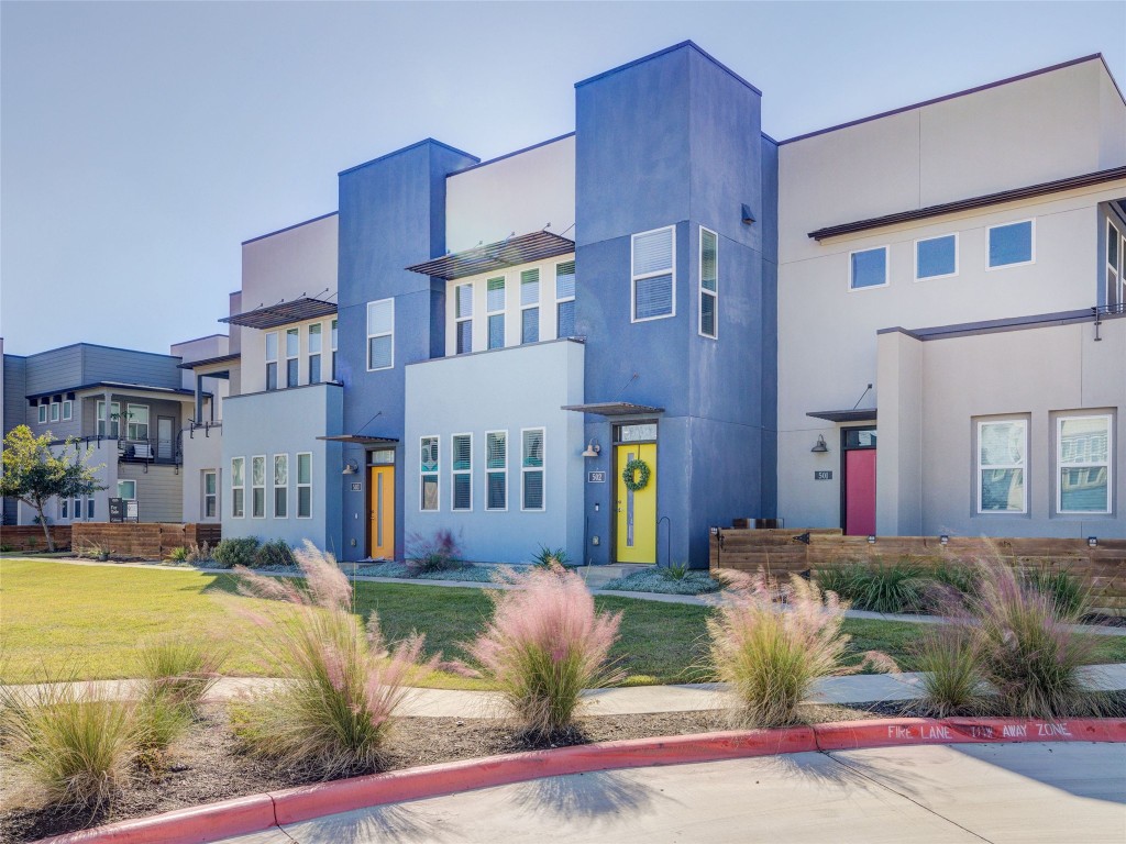 9015 Cattle Baron Path, Unit 502 Austin, TX 78747 - Photo 2 of 40 a front view of a house with swimming pool and outdoor seating