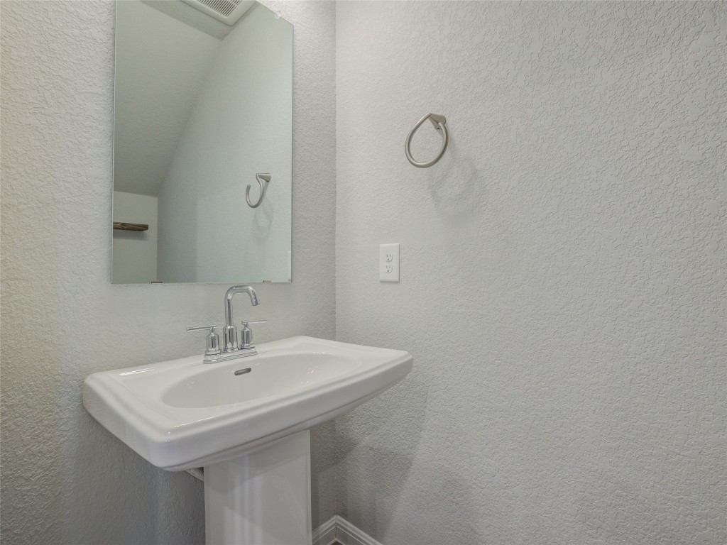9015 Cattle Baron Path, Unit 502 Austin, TX 78747 - Photo 31 of 40 a sink and a mirror