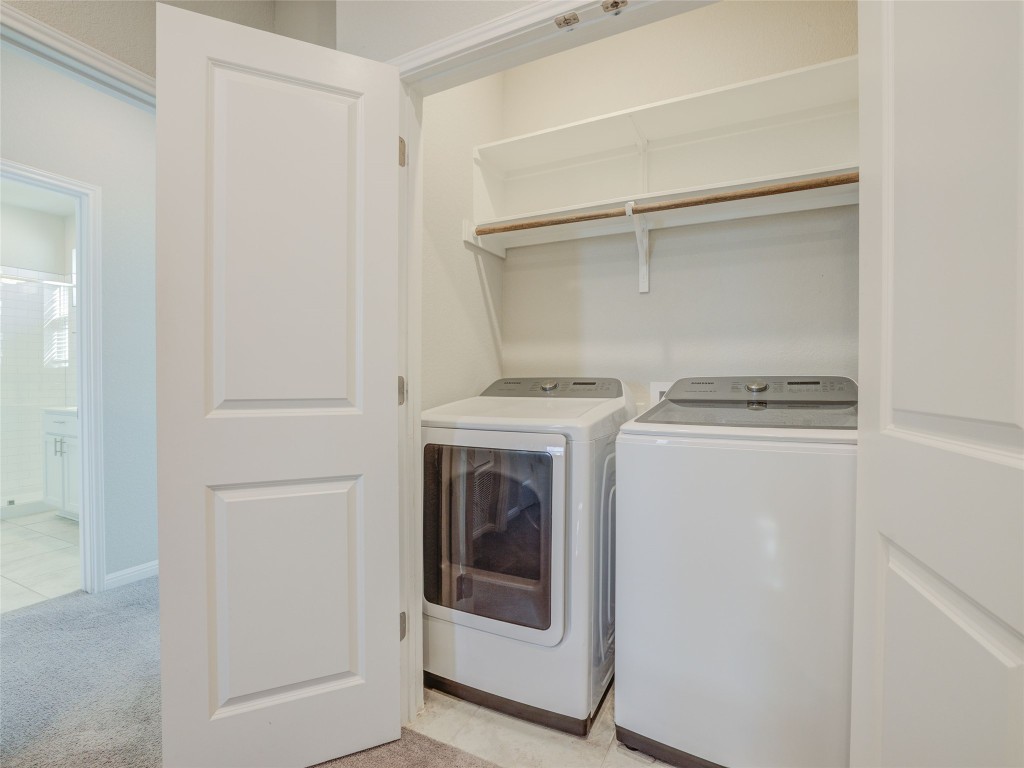 9015 Cattle Baron Path, Unit 502 Austin, TX 78747 - Photo 32 of 40 a utility room with washer and dryer