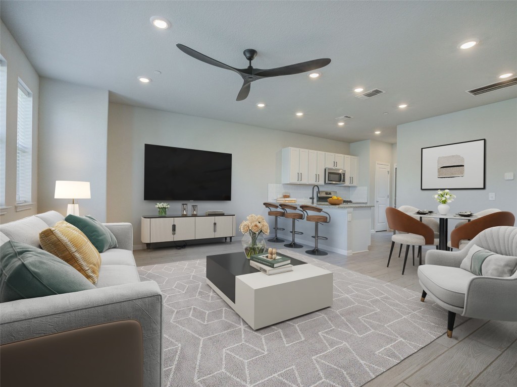 9015 Cattle Baron Path, Unit 502 Austin, TX 78747 - Photo 6 of 40 a living room with furniture and a flat screen tv