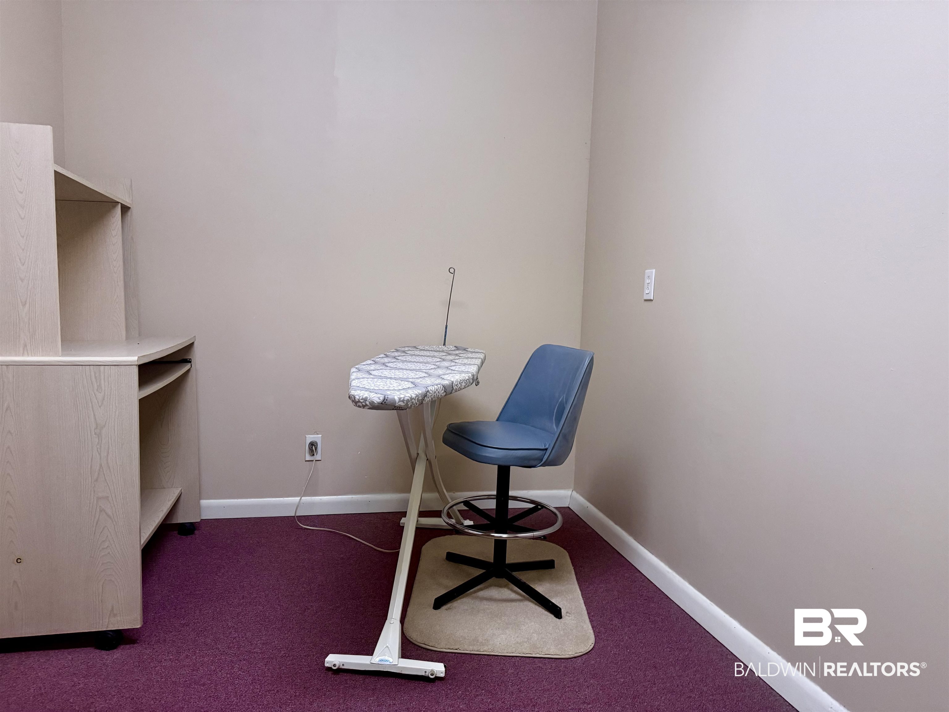 215 Young Street Brewton, AL 36426 - Photo 18 of 25 Office area with dark carpet and baseboards