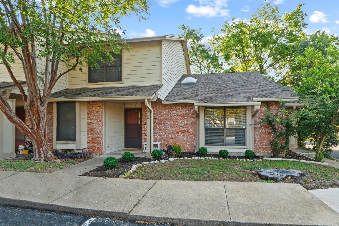 front view of a house and a yard