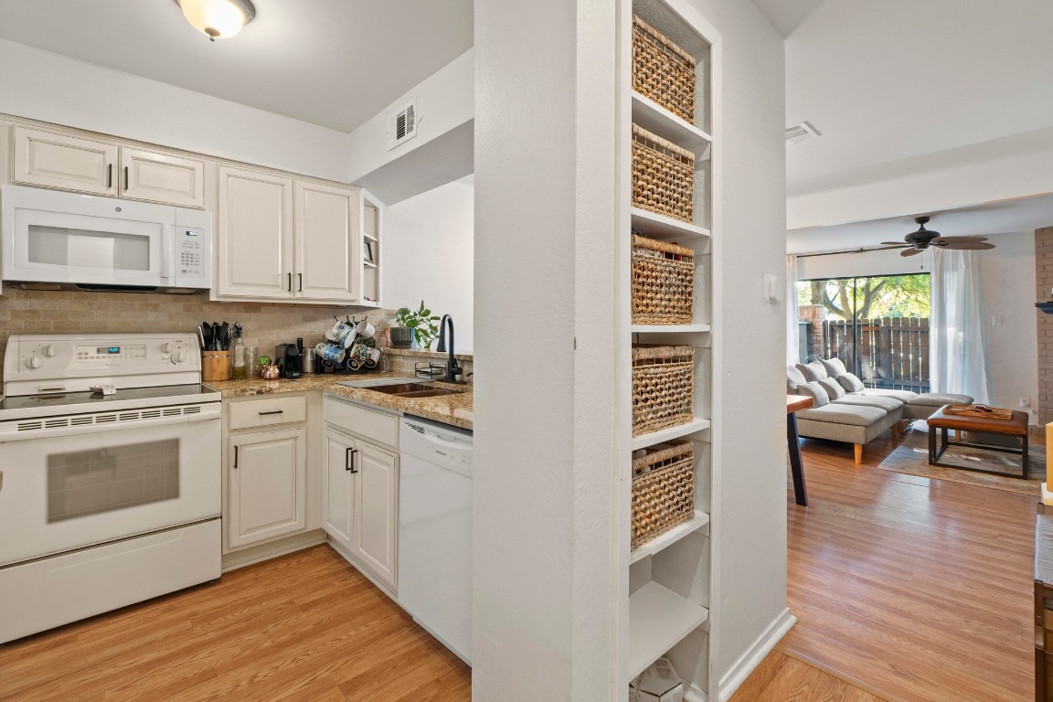 3801 Menchaca Road, Unit 5 Austin, TX 78704 - Photo 12 of 40 a kitchen with a cabinets and appliances
