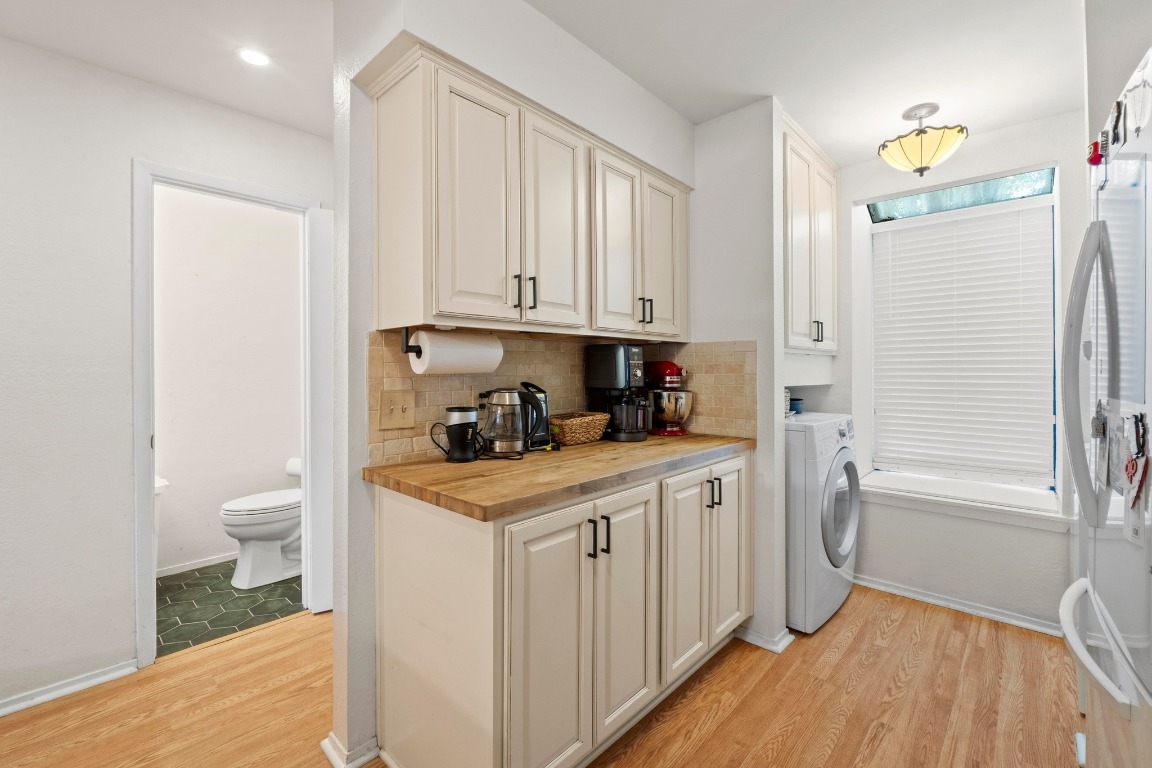 3801 Menchaca Road, Unit 5 Austin, TX 78704 - Photo 15 of 40 a kitchen with stainless steel appliances white cabinets and a refrigerator