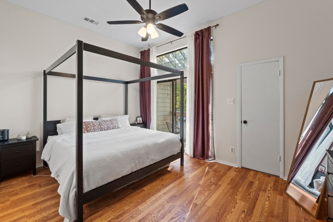 3801 Menchaca Road, Unit 5 Austin, TX 78704 - Photo 19 of 40 a bedroom with a bed and a large mirror