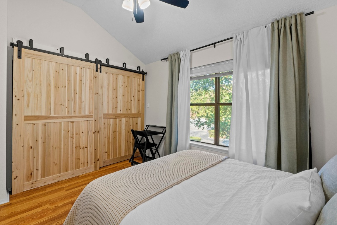 3801 Menchaca Road, Unit 5 Austin, TX 78704 - Photo 24 of 40 a bedroom with a bed and a window